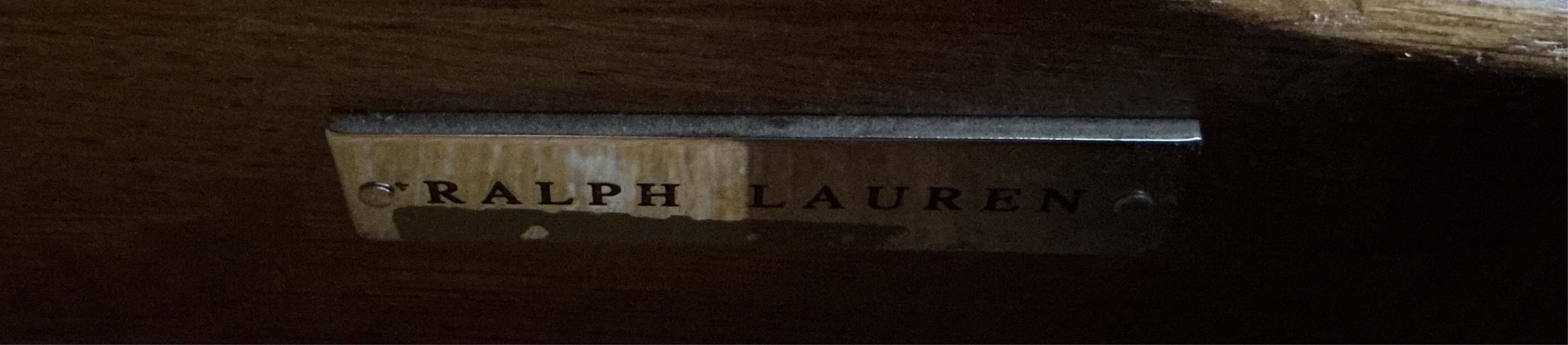 A brass mounted oak media cabinet, retailed by Ralph Lauren, upper section with bi-fold doors, width 140cm, depth 53cm, height 225cm